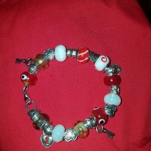 A heart and key murano charm bracelet